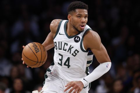 Milwaukee Bucks forward Giannis Antetokounmpo dribbles the ball against the Brooklyn Nets during the second half of a NBA basketball game, Sunday, Oct. 27, 2024, in New York. (AP Photo/Noah K. Murray)